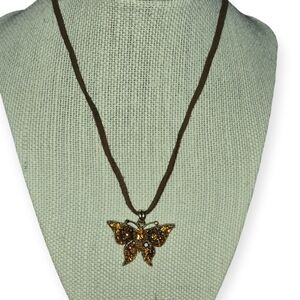 Vintage Amber Crystal Butterfly Necklace In Antique Gold Setting On Brown Suede